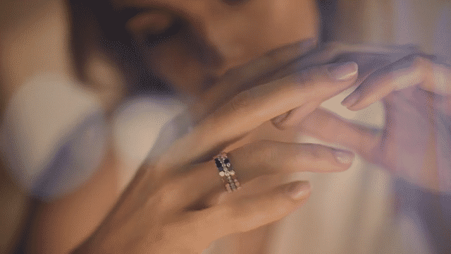 edit of different pieces of jewelery appearing through light beams on a blonde model