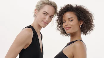 Vichy B3 Commercial still of two female models standing in a white world and staring into camera directed by Barnaby Roper